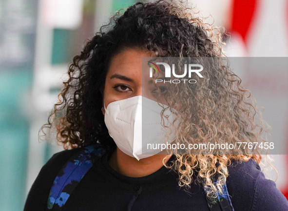 A woman wearing a face mask walks in Santa Cruz De tenerife on 13 February 2022. 