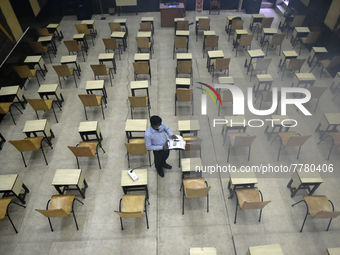 A man sanitises a primary school before it re-opens as the school close due to coronavirus surge in Kolkata, India, 15 February, 2022.  (