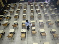 A man sanitises a primary school before it re-opens as the school close due to coronavirus surge in Kolkata, India, 15 February, 2022.  (