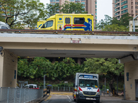 Ambulances arrive and leave the Queen Elisabeth Hospital Accident and Emergency ward in Kowloon, in Hong Kong, China, on February 17, 2022....