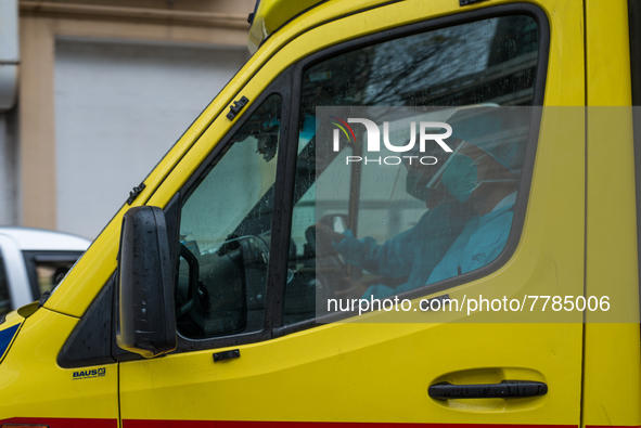 Ambulance staff in full PPE leave Queen Elisabeth hospital for another intervention, in Hong Kong, China, on February 17, 2022.  