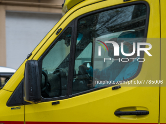 Ambulance staff in full PPE leave Queen Elisabeth hospital for another intervention, in Hong Kong, China, on February 17, 2022.  (