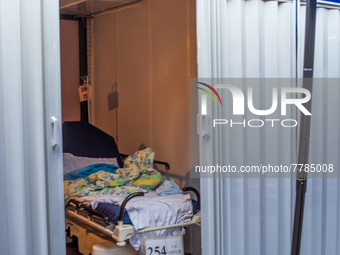 A makeshift cabin with an empty bed can be seen at Queen Elisabeth hospital, in Hong Kong, China, on February 17, 2022.  (