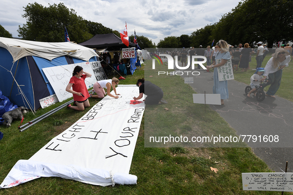 Members of the public take part in a protest organized by the Freedom and Rights Coalition in Christchurch, New Zealand on February 19, 2022...