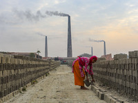 Workers are working at a brickyard in Dhaka Bangladesh on February 20, 2022.(