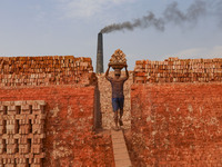 Workers are working at a brickyard in Dhaka Bangladesh on February 20, 2022.(