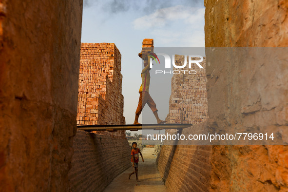 Workers are working at a brickyard in Dhaka Bangladesh on February 20, 2022.