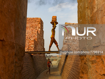 Workers are working at a brickyard in Dhaka Bangladesh on February 20, 2022.(