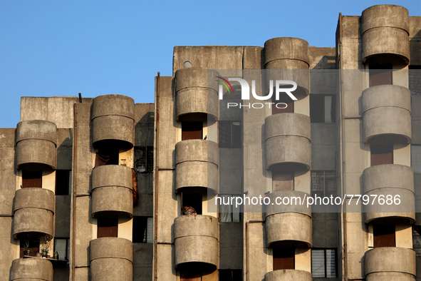 A woman stands in a balcony of her apartment at a residential neighborhood in Ghaziabad, on the outskirts of New Delhi, India on February 20...