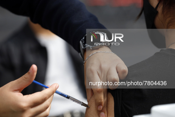 A person receives the Sputnik-V dose booster   inside Sport City facilities, during the mass vaccination campaign for citizens of 18 - 29 ye...