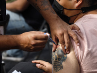 A person receives the Sputnik-V dose booster   inside Sport City facilities, during the mass vaccination campaign for citizens of 18 - 29 ye...