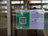 A notice is affixed at the entrance of the Megabox mall, advising people that the premises are subject to the ''vaccine pass'' and that peop...