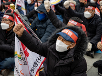 Farmers shout slogans during the National Farmers' Congress hold in front of the Korea Development Bank in Yeouido, Seoul, on February 25 20...