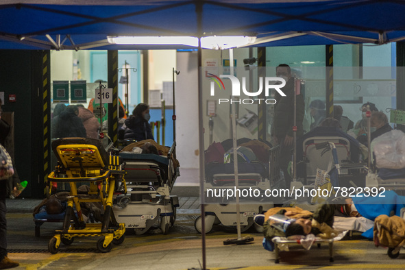 COVID Patients are placed on hospital beds outside the Accident & Emergency ward of Caritas Medical Centre, in Hong Kong, China, on February...