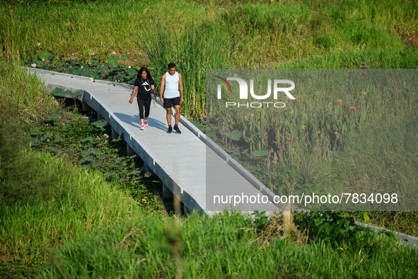 People are seen walking around the Benchakitti Forest Park on February 27, 2022 in Bangkok, Thailand. As Thailand COVID-19 situation today,...