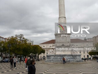 A man wearing a protective mask is seen walking around Praça de Rossio, Lisbon. February 20, 2022. The Portuguese General Health Direction (...