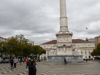 A man wearing a protective mask is seen walking around Praça de Rossio, Lisbon. February 20, 2022. The Portuguese General Health Direction (...