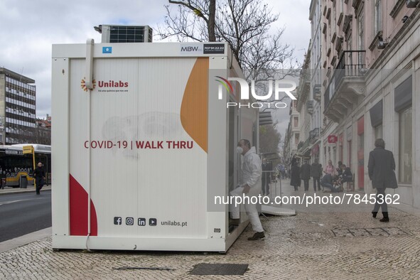 Health staff are seen entering one of the COVID-19 testing units set up near Praça da Liberdade, Lisbon. February 20, 2022. The Portuguese G...