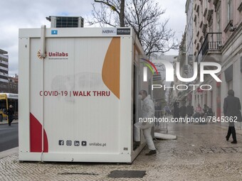 Health staff are seen entering one of the COVID-19 testing units set up near Praça da Liberdade, Lisbon. February 20, 2022. The Portuguese G...