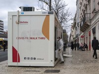 Health staff are seen entering one of the COVID-19 testing units set up near Praça da Liberdade, Lisbon. February 20, 2022. The Portuguese G...