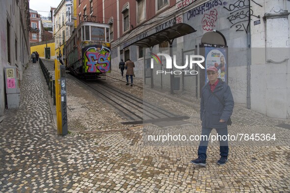 A person is seen walking near the Gloria elevator in the Restauradores neighborhood, Lisbon. February 20, 2022. The Portuguese General Healt...