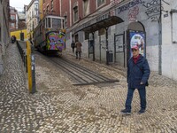 A person is seen walking near the Gloria elevator in the Restauradores neighborhood, Lisbon. February 20, 2022. The Portuguese General Healt...