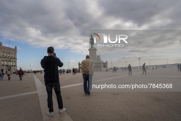 People are seen walking around Praça de Comercio, Lisbon. February 20, 2022.  The Portuguese General Health Direction (DGS) has registered 2...