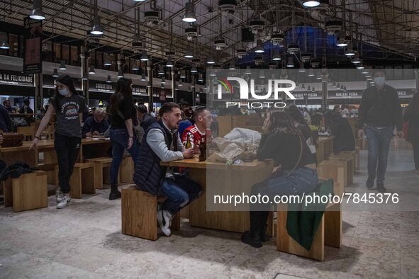 Some people wearing protective masks are seen enjoying drinks on the facilities of Ribeira market, Lisbon. February 20, 2022. The Portuguese...