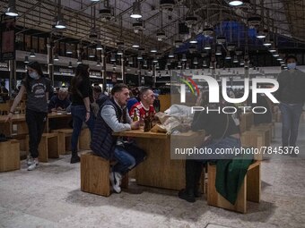 Some people wearing protective masks are seen enjoying drinks on the facilities of Ribeira market, Lisbon. February 20, 2022. The Portuguese...