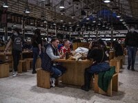 Some people wearing protective masks are seen enjoying drinks on the facilities of Ribeira market, Lisbon. February 20, 2022. The Portuguese...