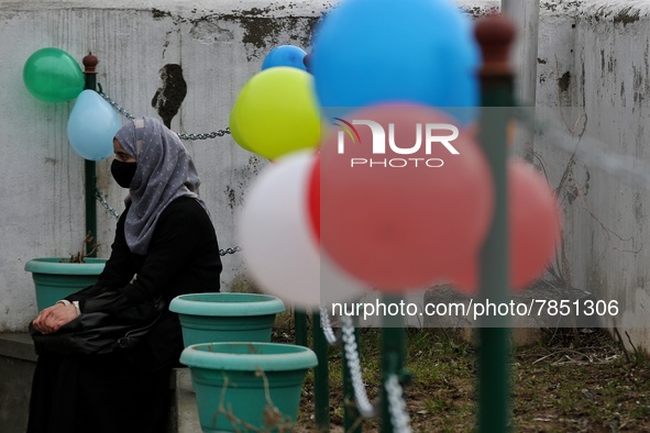 A student wearing hijab sits outside the principal office at Government Higher secondary girls school in Baramulla Jammu and Kashmir India o...