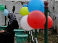 A student wearing hijab sits outside the principal office at Government Higher secondary girls school in Baramulla Jammu and Kashmir India o...