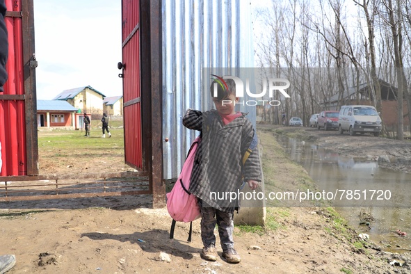 A student of a government school is pictured at the entrance of a school in Baramulla Jammu and Kashmir India on 02 March 2022. Schools in K...