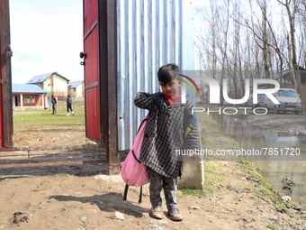 A student of a government school is pictured at the entrance of a school in Baramulla Jammu and Kashmir India on 02 March 2022. Schools in K...