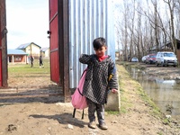 A student of a government school is pictured at the entrance of a school in Baramulla Jammu and Kashmir India on 02 March 2022. Schools in K...