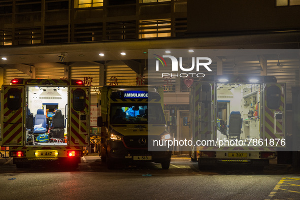 Three ambulances are awaiting their crew at Queen Elisabeth hospital in Kowloon, in Hong Kong, China, on March 04, 2022. 