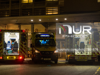 Three ambulances are awaiting their crew at Queen Elisabeth hospital in Kowloon, in Hong Kong, China, on March 04, 2022. (