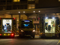 Three ambulances are awaiting their crew at Queen Elisabeth hospital in Kowloon, in Hong Kong, China, on March 04, 2022. (