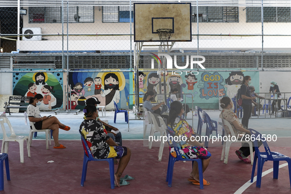 People wait for COVID-19 antigen test, amid the coronavirus Omicron (COVID-19) pandemic, in Bangkok, Thailand, 05 March 2022.  