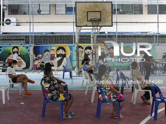 People wait for COVID-19 antigen test, amid the coronavirus Omicron (COVID-19) pandemic, in Bangkok, Thailand, 05 March 2022.  (