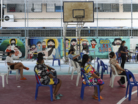 People wait for COVID-19 antigen test, amid the coronavirus Omicron (COVID-19) pandemic, in Bangkok, Thailand, 05 March 2022.  (