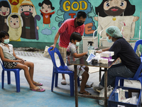 People wait for COVID-19 antigen test, amid the coronavirus Omicron (COVID-19) pandemic, in Bangkok, Thailand, 05 March 2022. (