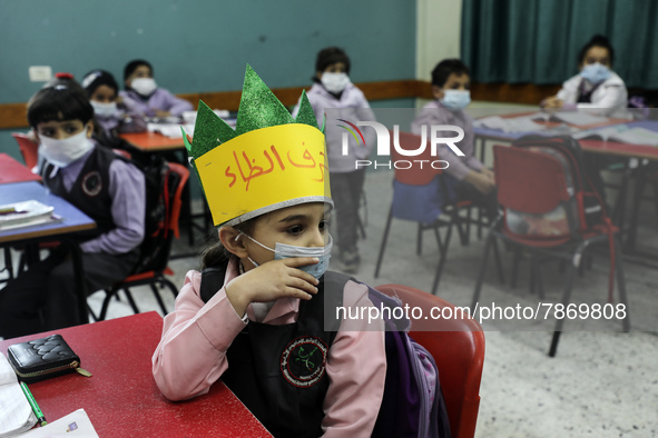 Palestinian students attend a class at a private school in Gaza City, on March 6, 2022. 