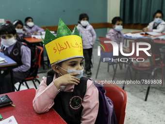 Palestinian students attend a class at a private school in Gaza City, on March 6, 2022. (