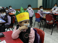 Palestinian students attend a class at a private school in Gaza City, on March 6, 2022. (