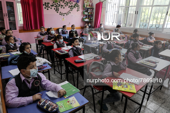 Palestinian students attend a class at a private school in Gaza City, on March 6, 2022. 