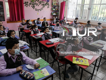 Palestinian students attend a class at a private school in Gaza City, on March 6, 2022. (