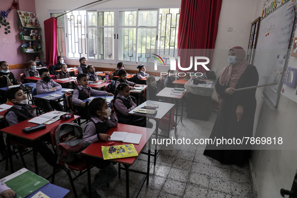 Palestinian students attend a class at a private school in Gaza City, on March 6, 2022. 