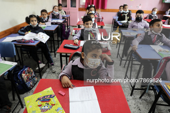 Palestinian students attend a class at a private school in Gaza City, on March 6, 2022. 