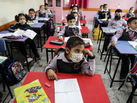 Palestinian students attend a class at a private school in Gaza City, on March 6, 2022. (